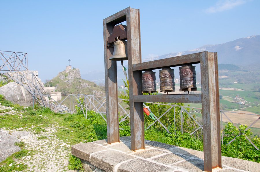 File:A European bell and three Tibetan prayer wheels on the summit of Pennabilli, Italy.jpg