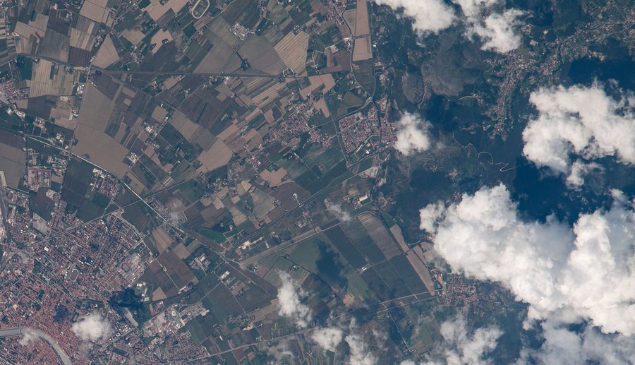 File:ISS065-E-93402 - View of Italy - San Giuliano Terme - Monte Castellare - Pisa-Lucca railway line - Asciano and Santa Maria del Giudice (Lucca) - Monti Pisani forests (cropped).jpg